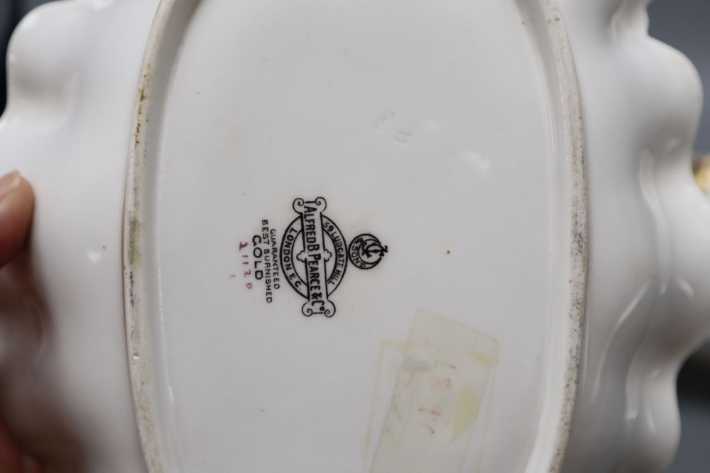 A pair of George Jones for Alfred Pearce Crescent china shaped oval dessert dishes, painted with rose bouquets, width 27cm